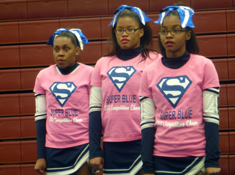 Members of the Southfield High Competitive Cheer team anxiously await their turn during a competition. 
