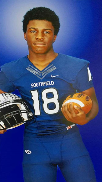 Rest in Peace: Darius Cooley, number 18, would have been a junior this year but drowned over the summer. His assistant football coach, Terrence Watson, took the above photo of Cooley in preparation for the season.